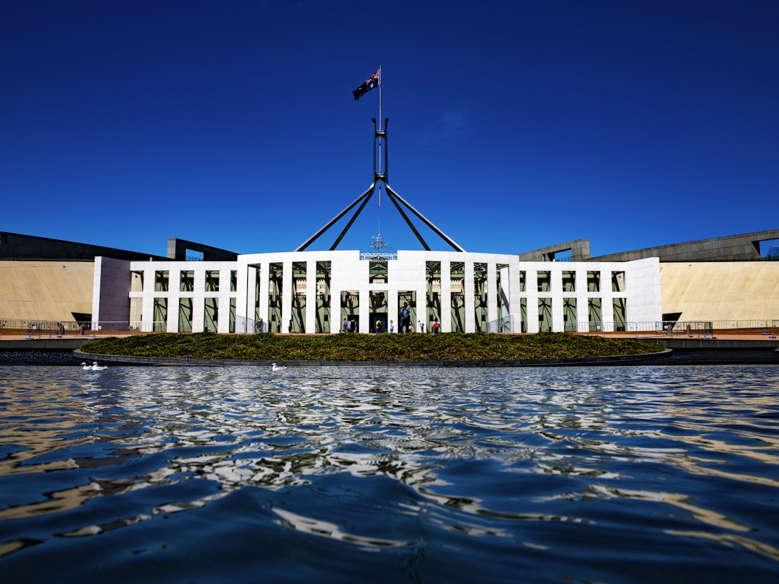 Parliament House in Canberra, Australia, reflected in its forecourt pool